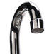 A close-up of a chrome gooseneck faucet with a handle and a hose.