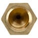 A close-up of a brass threaded nut with a gold color on a white background.