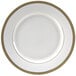A white porcelain charger plate with a gold rim.