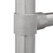 A close-up of a stainless steel Advance Tabco commercial sink drain pipe with a handle.