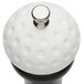 A white golf ball pepper mill with a silver knob.