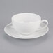 A 10 Strawberry Street Royal Coupe white porcelain cup and saucer on a white surface.