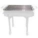 A Backyard Pro stainless steel cooking grate on a table outdoors.