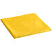 A yellow folded table cover with a white background.