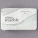 A white package of Dial White Marble Deodorant bar soap with black text.