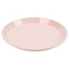 A light peach Cambro round fiberglass tray on a white background.