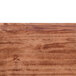 A close up of the Java teak wood surface on a Cambro rectangular tray.
