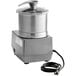 A silver Robot Coupe food processor with a black cord.