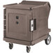 A large brown Cambro food holding cabinet on wheels.