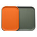 A close-up of an orange rectangular Cambro tray with an orange and grey insert.