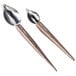 A pair of Zeroll stainless steel deco spoons with beech wood handles.