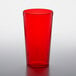 A red plastic GET tumbler on a white surface.