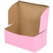 A pink bakery box with the lid open.