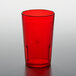 A red plastic GET tumbler on a white table.