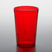 A red plastic GET tumbler on a gray surface.