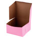 A 7" x 7" x 4" pink bakery box with a brown lid.