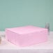 A pink bakery box with a white edge.