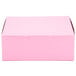 A pink bakery box with a lid on a white background.