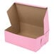 A Baker's Mark pink bakery box with the lid open.