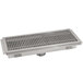 A white stainless steel floor trough drain with a metal grate.