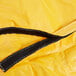 A close up of a yellow Rubbermaid caddy bag with black stitching and a zipper.