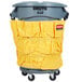 A grey Rubbermaid caddy with a yellow bag on wheels.