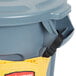 A yellow Rubbermaid caddy bag in use on a 32 or 44 gallon trash can.