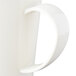 A close up of a white Carlisle Tritan mug with a handle.