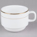 A bright white porcelain coffee cup with a gold rim.