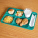A right-handed aqua Cambro compartment tray with food on it.