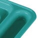 A close-up of a teal Cambro co-polymer compartment tray with white lines.