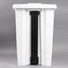 A white Rubbermaid rectangular plastic step-on container with black handles.