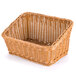 A honey colored plastic cascading basket with a handle.
