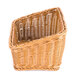 A honey-colored plastic basket with a curved top.