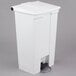 A white Rubbermaid rectangular step-on trash can with a black lid.