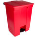 A red Rubbermaid rectangular step-on trash can with a lid and handle.