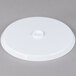 A white plastic Fineline cake stand lid with a screw on top.