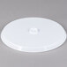 A white plastic Fineline Platter Pleasers cake stand lid with a hexagon on top.