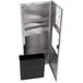 A stainless steel metal cabinet with a black container inside.