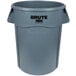 A grey plastic Rubbermaid Brute trash can with black text on it.