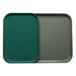 A teal Cambro tray insert on a green tray.