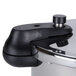 A stainless steel Matfer Bourgeat pressure cooker with a black handle and a lid on a counter.