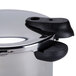A Matfer Bourgeat stainless steel pressure cooker pot with lid and handle.