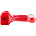 A red plastic water faucet handle with a hole.