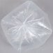 A Berry medium-duty clear plastic trash bag with a hole in the middle.