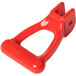 A red plastic Bunn faucet handle with a hole.
