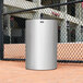 A white Rubbermaid Atrium waste receptacle with a silver round top.