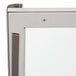 The stainless steel door of a Nemco countertop pizza merchandiser with a latch.