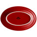 A red oval china platter with a white border.