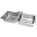 A stainless steel Advance Tabco double sink with two faucets.